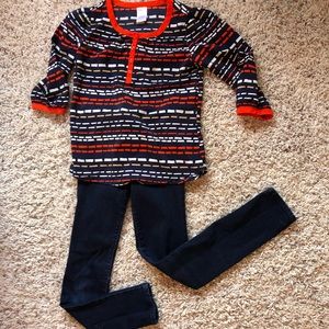 Blue jeans and 3/4 sleeve printed blouse.